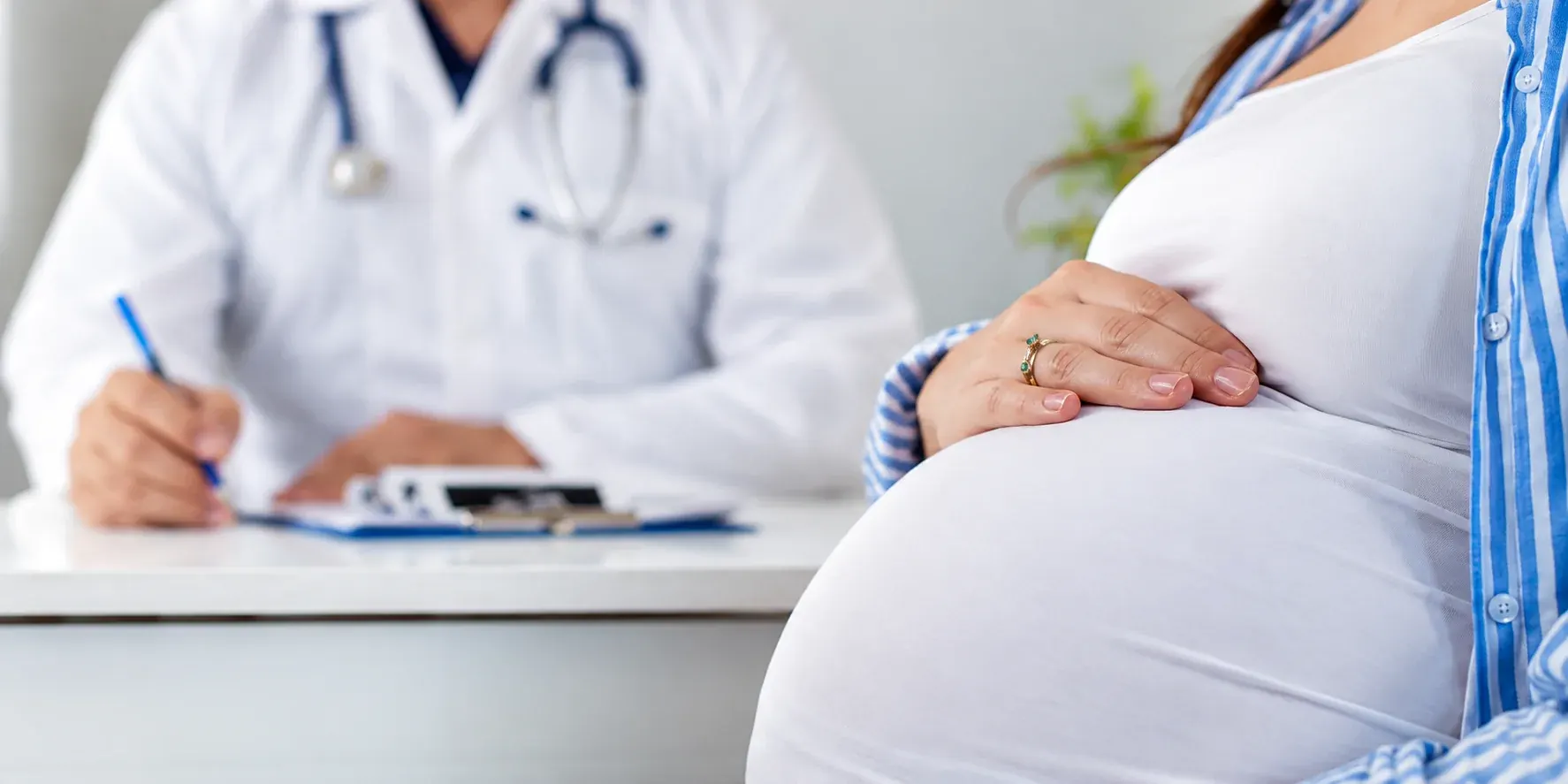 A fertility specialist in conversation with a patient during a consultation